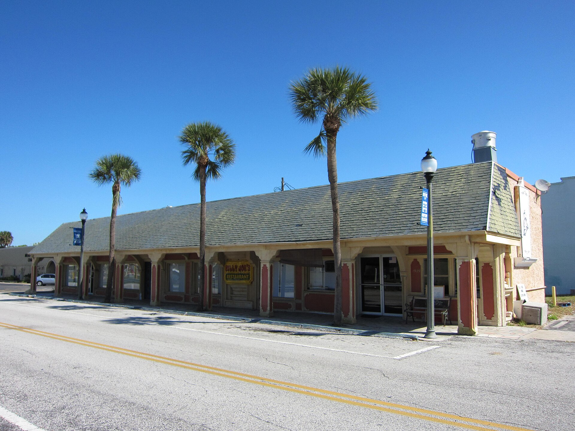 The former Melbourne railroad depot building at 1929 Depot Drive, a long single-story structure now repurposed as shops.
