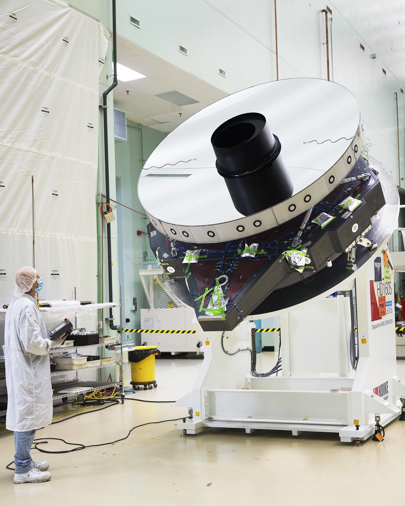 The Roman Space Telescope primary mirror completed at L3Harris Technologies in Melbourne, Florida, photographed in a clean room.